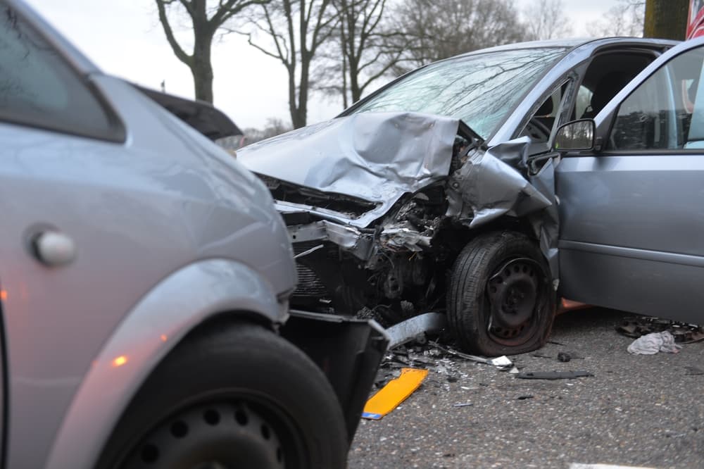 Two identical cars crash head to head