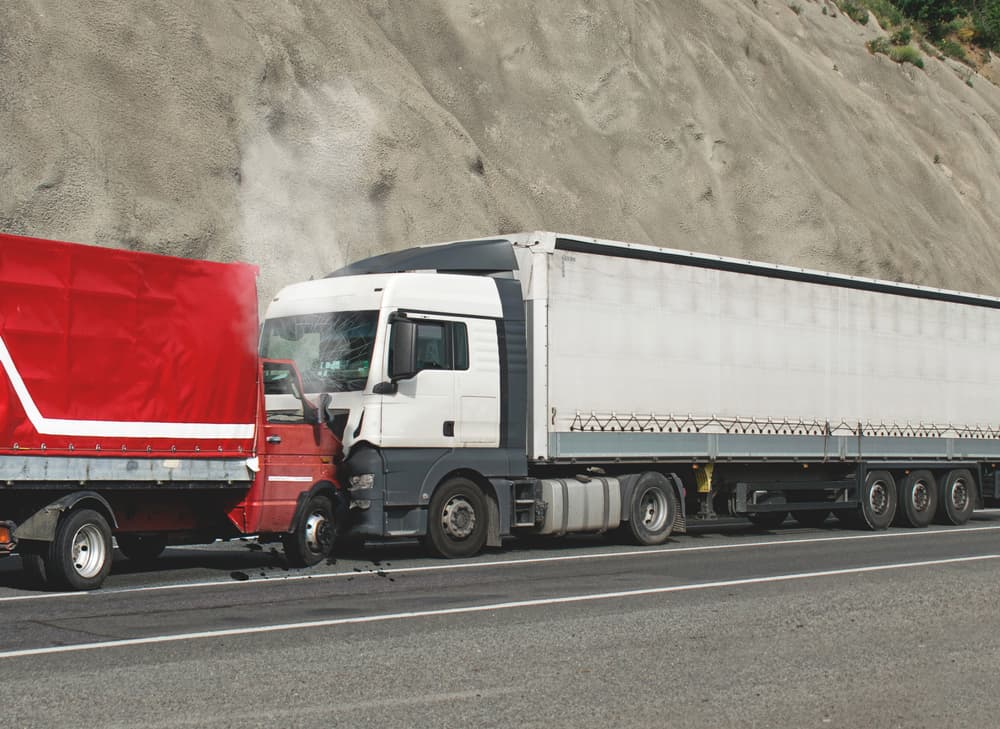 Two Truck Head-On Collision on the Road