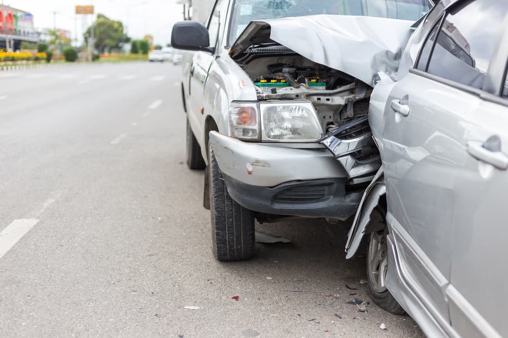 Two car rear end crash with each other on the road