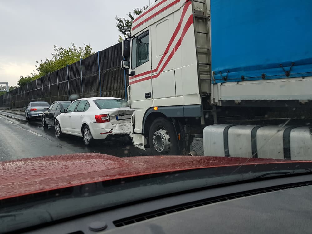 A truck and car rear-ended accident on the road