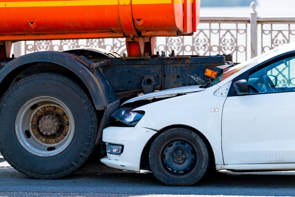 A White Car Underride with the Semi Truck