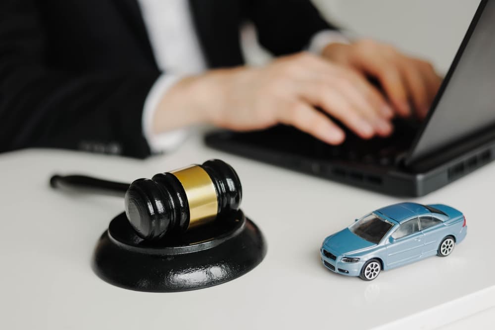 A car accident lawyer working on laptop